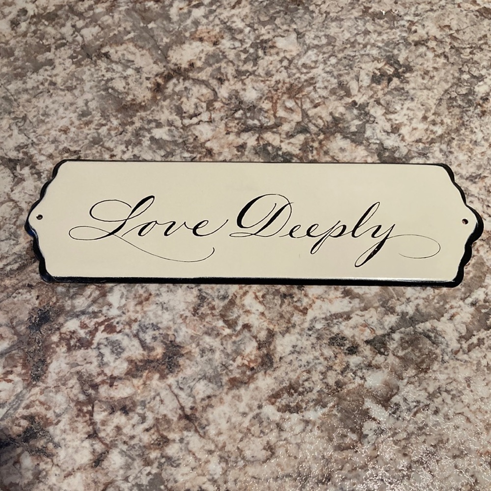 Love deeply tin sign